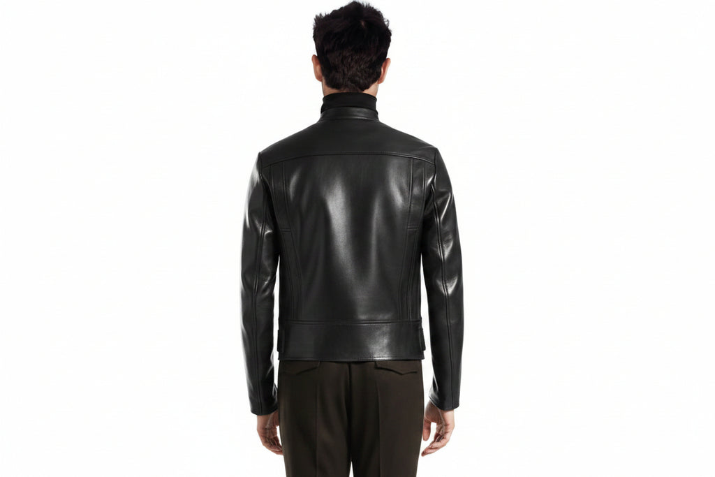 Men's Apex Minimalist genuine real soft lambskin leather moto jacket in sleek jet black featuring a snap-button mandarin collar, asymmetrical off-center front zipper closure, horizontal zip waist pockets, small snap flap coin pocket, integrated buckled waist belt, zippered sleeve cuffs, tailored slim fit, and custom made-to-measure tailoring available worldwide.back