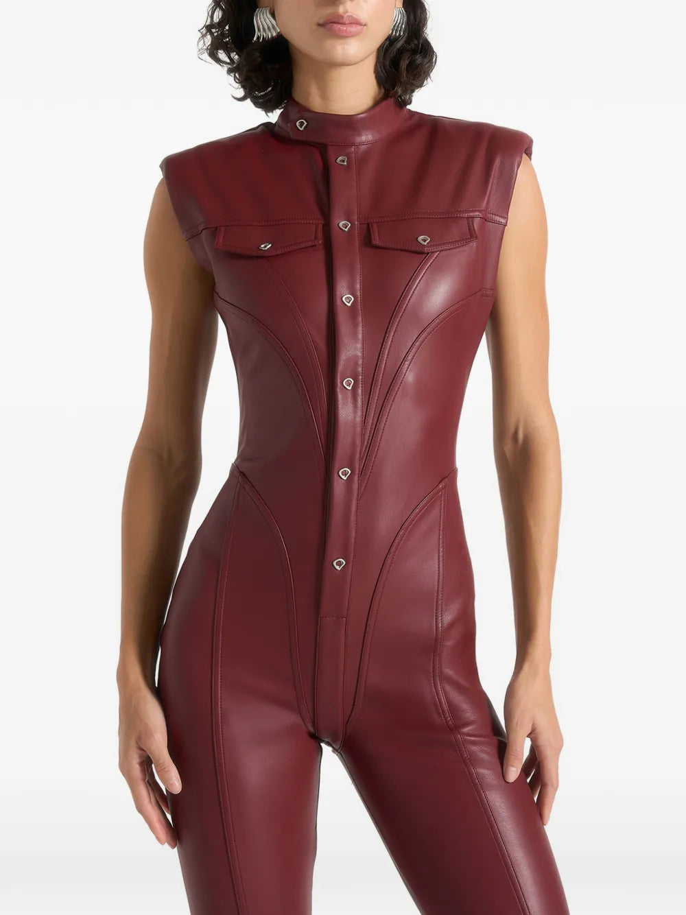 Aurelia Luxe women's deep burgundy maroon genuine lambskin leather jumpsuit featuring a high mandarin stand collar, cap shoulders, full-length front snap button placket, dual chest flap pockets, waist-contouring vertical seams, flared bootcut legs, and custom made-to-measure fitting across the UK, USA, and Australia.extra1