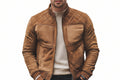 Black Anthem men's tobacco tan suede leather jacket featuring diamond-quilted shoulders, stand collar, ribbed knit trim, zippered pockets, and custom made-to-measure fitting across the UK, USA, and Australia.