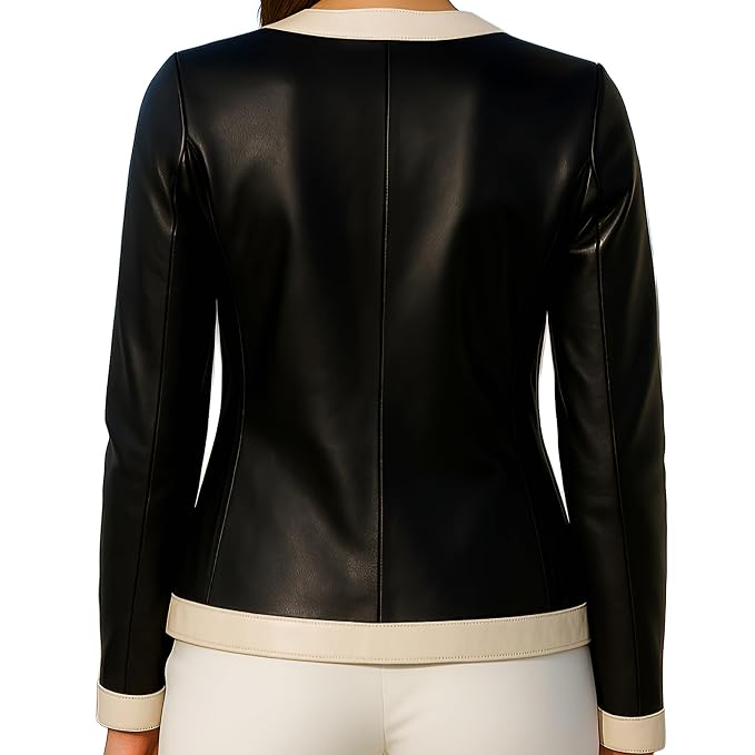 A black faux leather jacket with cream-colored trim at the collar, hem, and cuffs, shown from the back on a model.