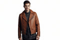 Men's classic cognac tan genuine soft lambskin real leather motorcycle biker jacket featuring broad snap-down notch lapels, asymmetrical front zip closure, diagonal zipper chest pocket, zipper expansion cuffs, long fitted sleeves, and custom made-to-measure fitting across the UK, USA, and Australia.