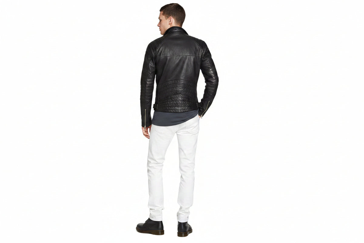 Men's Classic genuine real soft lambskin leather biker jacket in sleek jet black featuring wide notch lapels with silver press-stud snaps, asymmetrical off-center front zipper closure, ribbed channel-quilted shoulder panels, sloped zip chest pocket, zip hand pockets, snap-flap coin pocket, side waist cinch buckles, zippered sleeve cuffs, tailored slim fit, and custom made-to-measure tailoring available worldwide.back