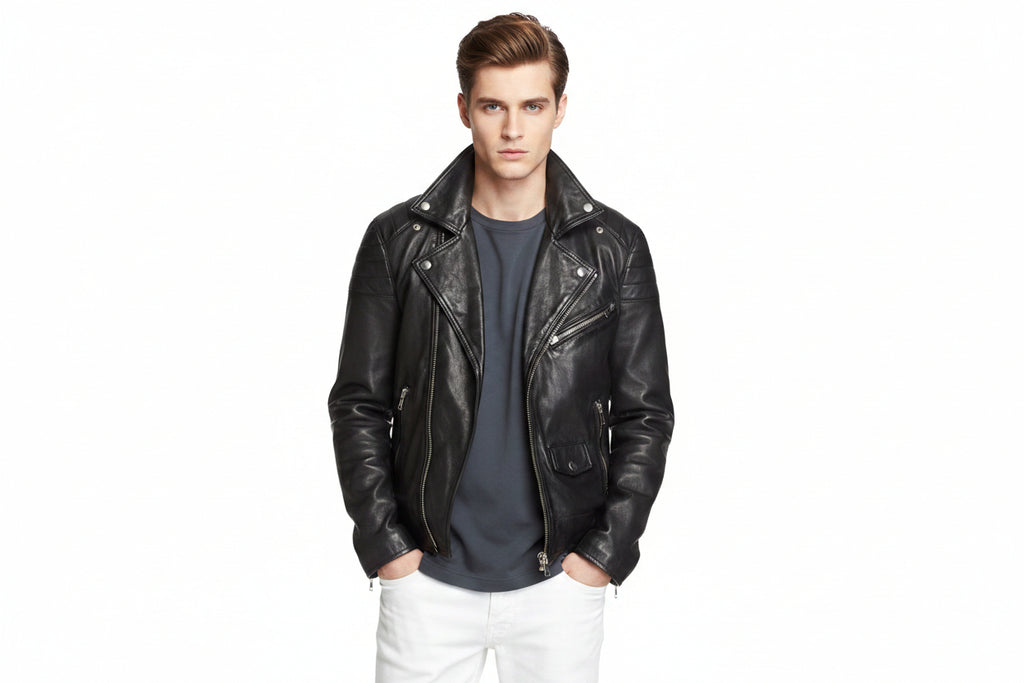 Men's Classic genuine real soft lambskin leather biker jacket in sleek jet black featuring wide notch lapels with silver press-stud snaps, asymmetrical off-center front zipper closure, ribbed channel-quilted shoulder panels, sloped zip chest pocket, zip hand pockets, snap-flap coin pocket, side waist cinch buckles, zippered sleeve cuffs, tailored slim fit, and custom made-to-measure tailoring available worldwide.