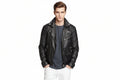 Men's Classic genuine real soft lambskin leather biker jacket in sleek jet black featuring wide notch lapels with silver press-stud snaps, asymmetrical off-center front zipper closure, ribbed channel-quilted shoulder panels, sloped zip chest pocket, zip hand pockets, snap-flap coin pocket, side waist cinch buckles, zippered sleeve cuffs, tailored slim fit, and custom made-to-measure tailoring available worldwide.