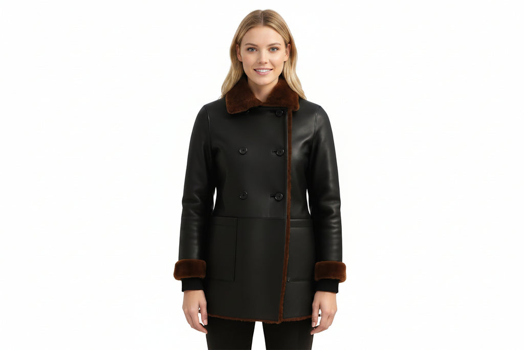 Darkthread women's matte black genuine lambskin leather jacket featuring a double-breasted button front, brown shearling fur spread collar, matching fur edge trim and cuffs, front patch pockets, and custom made-to-measure fitting across the UK, USA, and Australia.