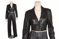 Elara Edge women's dark espresso black genuine lambskin leather jumpsuit featuring blazer-style notch lapels, deep V-neckline, long sleeves, slender metallic waist belt, straight wide-leg trousers, side pockets, and custom made-to-measure fitting across the UK, USA, and Australia.
