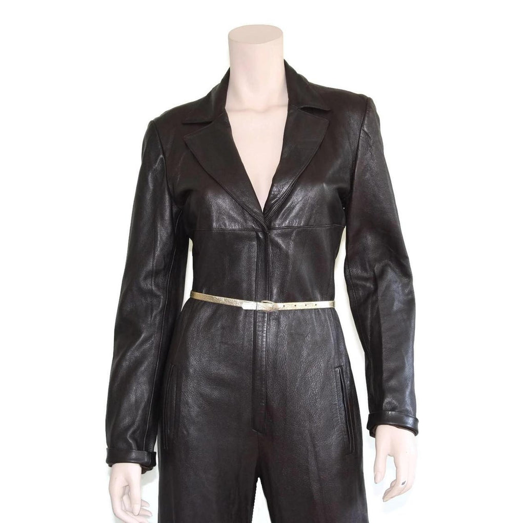 Elara Edge women's dark espresso black genuine lambskin leather jumpsuit featuring blazer-style notch lapels, deep V-neckline, long sleeves, slender metallic waist belt, straight wide-leg trousers, side pockets, and custom made-to-measure fitting across the UK, USA, and Australia.side