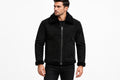 Front view of a man wearing the black Ghost Throttle Zipper Front Suede Leather Jacket featuring a plush shearling collar and trim.   