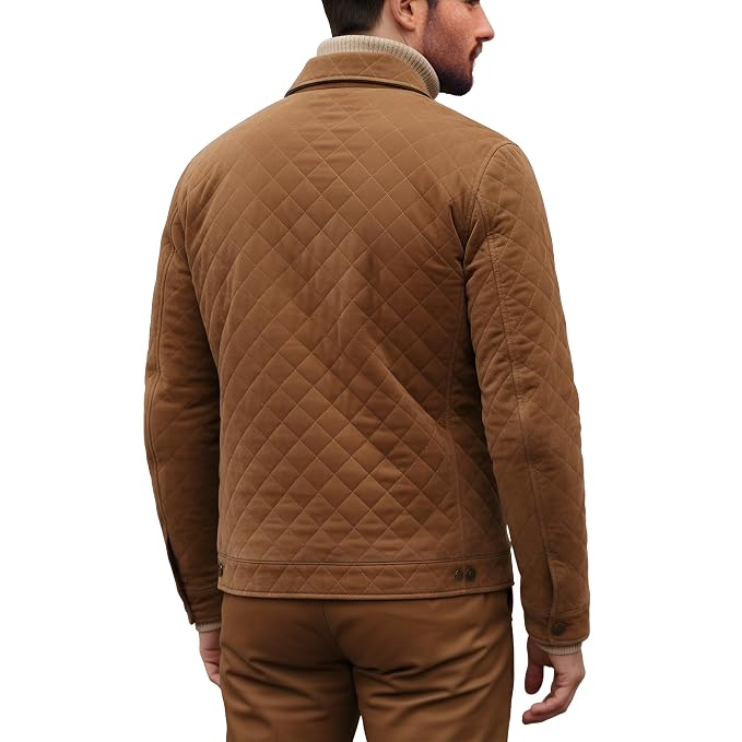Back view of a man wearing the tan brown Grain Forge Aristocrat Premium Suede Jacket featuring a shirt collar, zip front, and quilted pockets.
