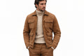 Front view of a man wearing the tan brown Grain Forge Aristocrat Premium Suede Jacket featuring a shirt collar, zip front, and quilted pockets.