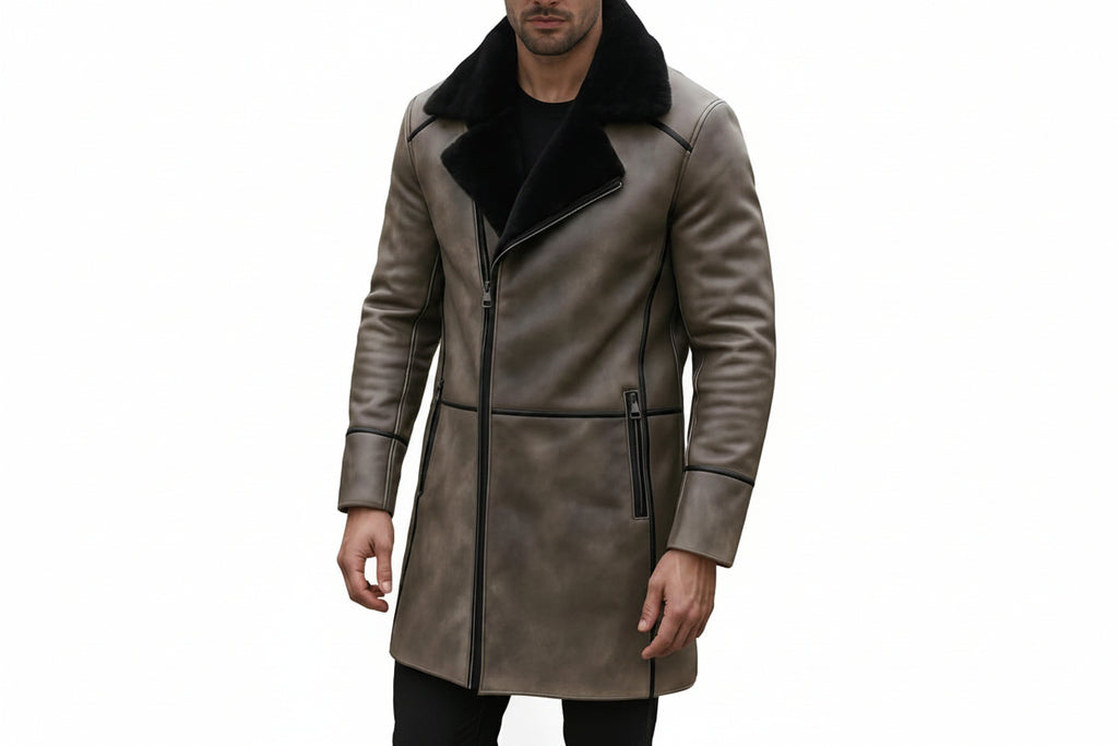 Men's iron blazer longline vintage genuine soft nappa real leather coat in distressed taupe grey featuring a contrasting plush wide black shearling fleece collar, asymmetrical diagonal zip front closure, black leather seam piping trim on shoulders and cuffs, vertical metal zippered side pockets, mid-thigh length cut, and custom made-to-measure fitting across the UK, USA, and Australia.