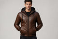 Front view of a man wearing the vintage brown Iron Grain Nappa Lambskin Leather Roadster Jacket featuring an attached hood and full-zip closure.