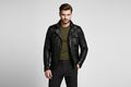 Men's Iron & Hide genuine real soft lambskin leather jacket in washed dark black featuring a high stand collar with metallic snap fasteners, offset asymmetrical front zipper closure, structured shoulder overlay caps, dual chest flap pockets, dual side hand pockets, tailored slim fit, and custom made-to-measure tailoring available worldwide.