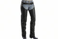 Black leather chaps worn over blue jeans with a black leather belt, shown on a model from the waist down against a white background.
