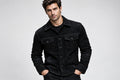 Front view of a man wearing the black Iron Stitch Suede Leather Jacket featuring a shirt collar, button closure, and chest flap pockets.