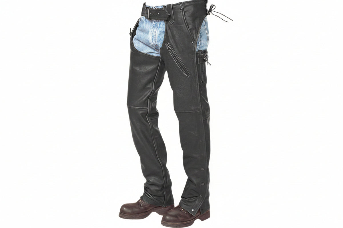 Men's iron trail western genuine soft lambskin real leather motorcycle riding chaps in black featuring an adjustable front belt buckle waistband, rear lace ties, diagonal upper thigh zipper pocket, full-length side leg zippers, lower ankle snap-button closures, open crotch over-jeans design, and custom made-to-measure fitting across the UK, USA, and Australia.