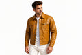 Front view of a man wearing the tan brown Iron Vane Minimalist Lambskin Leather Jacket featuring a shirt collar, button closure, and chest pockets.