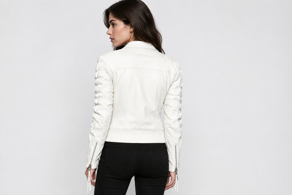 Back view of a woman wearing the Luna – Women's White Leather Jacket featuring a snap-tab collar and asymmetrical zipper.