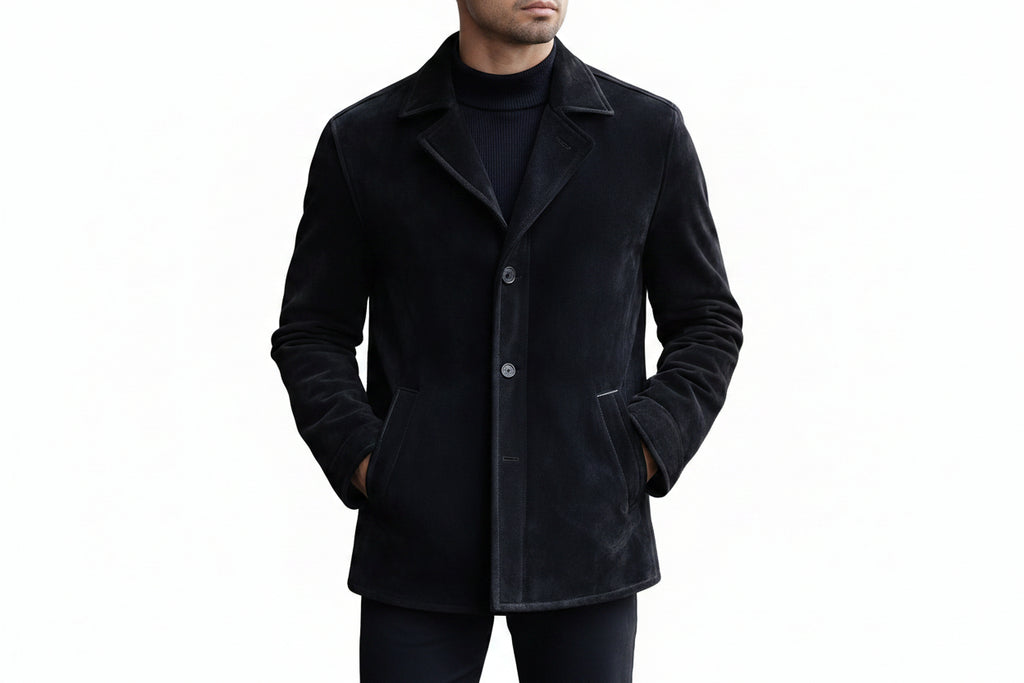 Men's luxe line contemporary genuine soft suede real leather short trench coat in matte jet black featuring a structured shirt-style collar with notch lapels, single-breasted button front closure, angled side handwarmer welt pockets, long fitted sleeves, clean mid-length cut, and custom made-to-measure fitting across the UK, USA, and Australia.