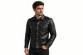 Front view of a man wearing the black Night Pelt Distressed Lambskin Cafe Racer Leather Jacket featuring a shirt collar, button closure, and utility chest pockets.   