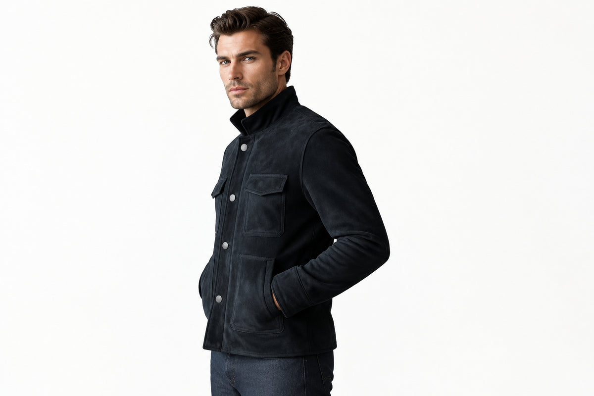 Side view of a man wearing the navy blue Obsidian Stitch Supreme Heritage Suede Jackets featuring a stand collar, button closure, and utility pockets.