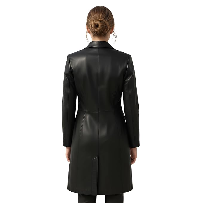 Rebel Aura women's jet black genuine Nappa leather long coat featuring sharp notch lapels, streamlined front closure, dual flap waist pockets, chest welt pocket, knee-length fit, and custom made-to-measure fitting across the UK, USA, and Australia.back