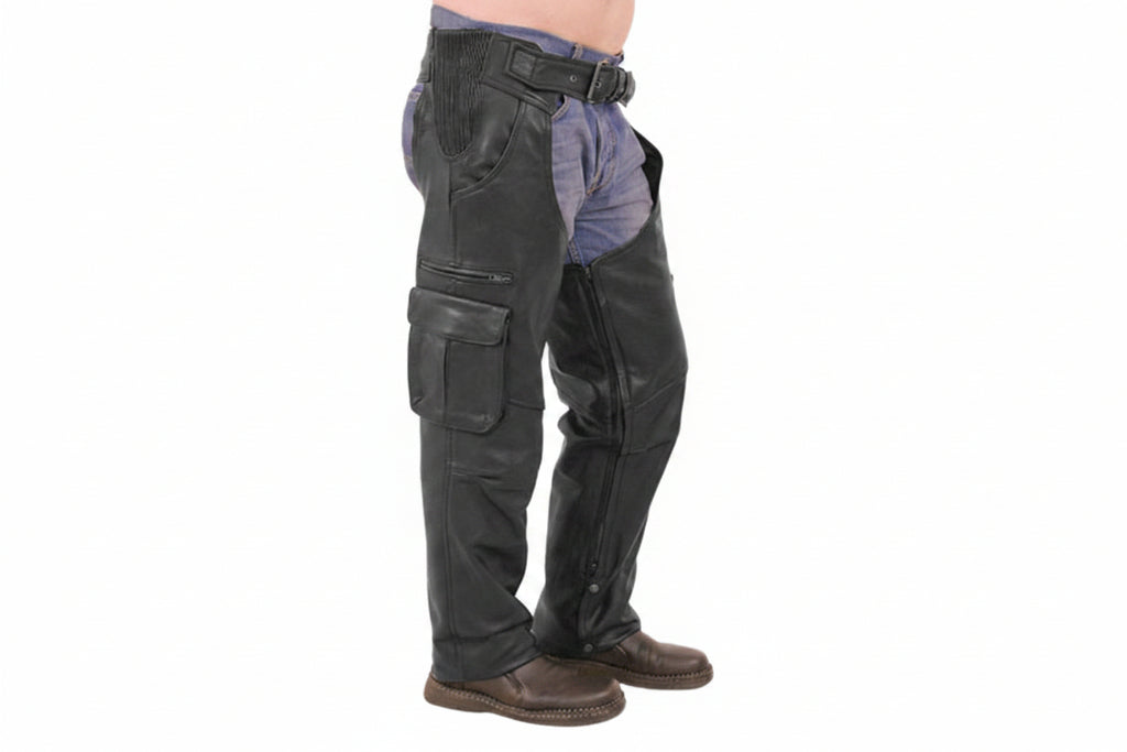 Men's rebel hide tactical genuine soft lambskin real leather motorcycle riding chaps in black featuring stretch-accordion ribbed elastic hip panels, adjustable front belt buckle, right thigh multi-pocket utility layout with horizontal zipper and flap cargo pocket, full-length side leg zippers, lower ankle snap-button closures, open crotch over-jeans design, and custom made-to-measure fitting across the UK, USA, and Australia.