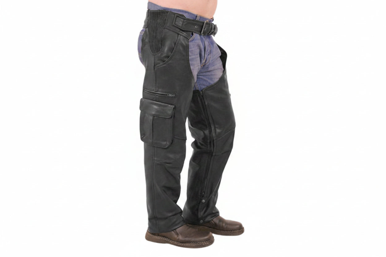 Men's rebel hide tactical genuine soft lambskin real leather motorcycle riding chaps in black featuring stretch-accordion ribbed elastic hip panels, adjustable front belt buckle, right thigh multi-pocket utility layout with horizontal zipper and flap cargo pocket, full-length side leg zippers, lower ankle snap-button closures, open crotch over-jeans design, and custom made-to-measure fitting across the UK, USA, and Australia.
