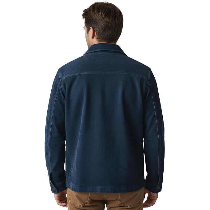 Back view of a man wearing the navy blue Rogue Mantle Monarch Elite Suede Jackets featuring a shirt collar, button closure, and utility flap pockets.