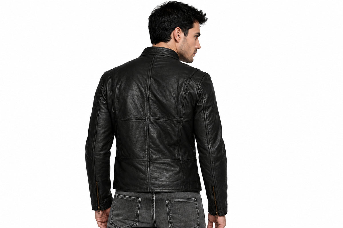Back view of a man wearing the black Royal Full-Grain Biker Jacket featuring a snap-tab collar and zippered pockets.