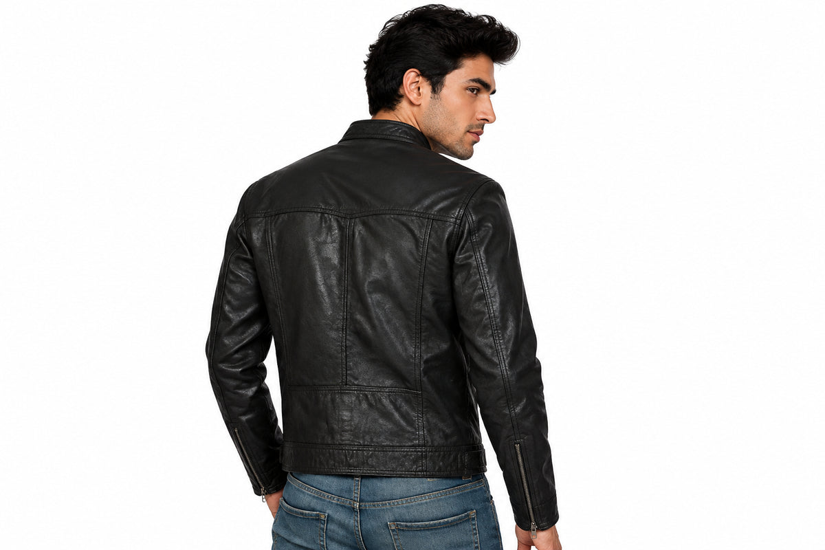 Back view of a man wearing the black Runway Asymmetrical Leather Biker Jacket featuring a snap-tab collar and offset zipper.
