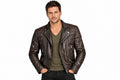 Front view of a man wearing the dark brown Shadowline Asymmetrical Moto Jacket featuring a snap-tab collar, offset zipper, and quilted shoulder padding.