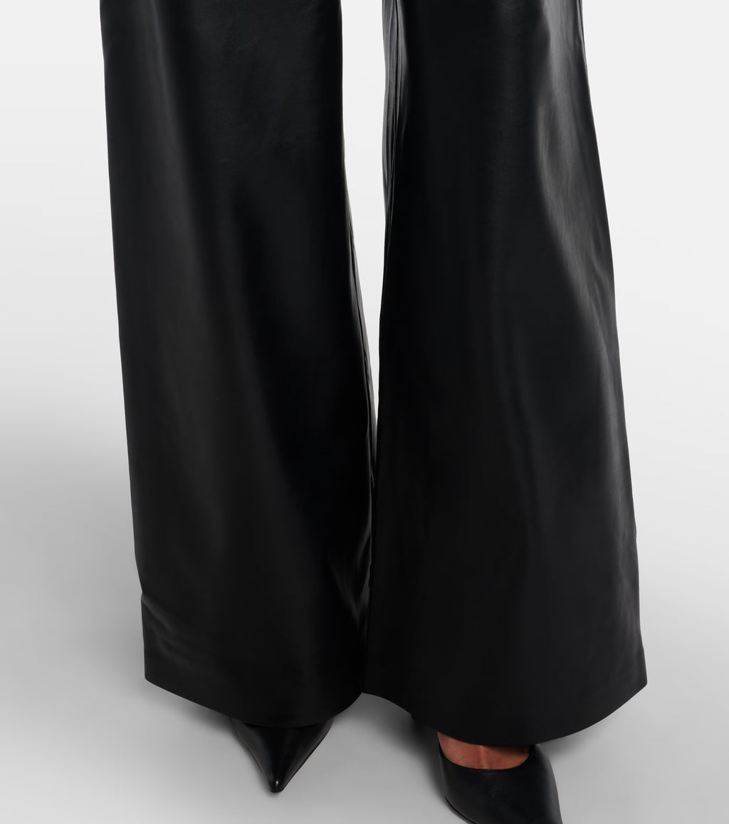 Sienna Noir women's jet black genuine Nappa lambskin leather jumpsuit featuring a trench coat style notch collar, chest storm flap, shoulder epaulettes, self-tie leather waist belt, wide-leg trousers, and custom made-to-measure fitting across the UK, USA, and Australia.bottom