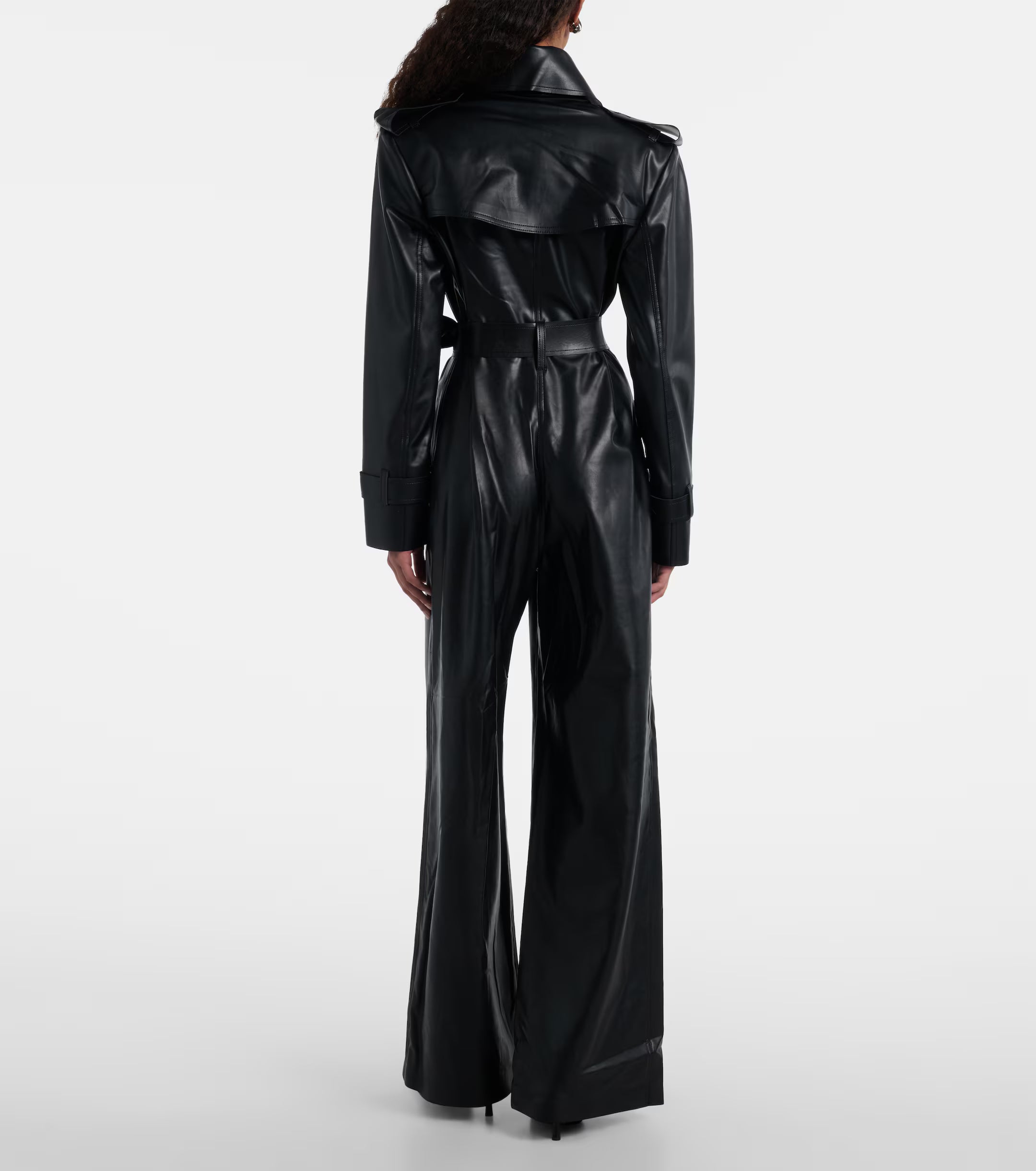 Sienna Noir women's jet black genuine Nappa lambskin leather jumpsuit featuring a trench coat style notch collar, chest storm flap, shoulder epaulettes, self-tie leather waist belt, wide-leg trousers, and custom made-to-measure fitting across the UK, USA, and Australia.back