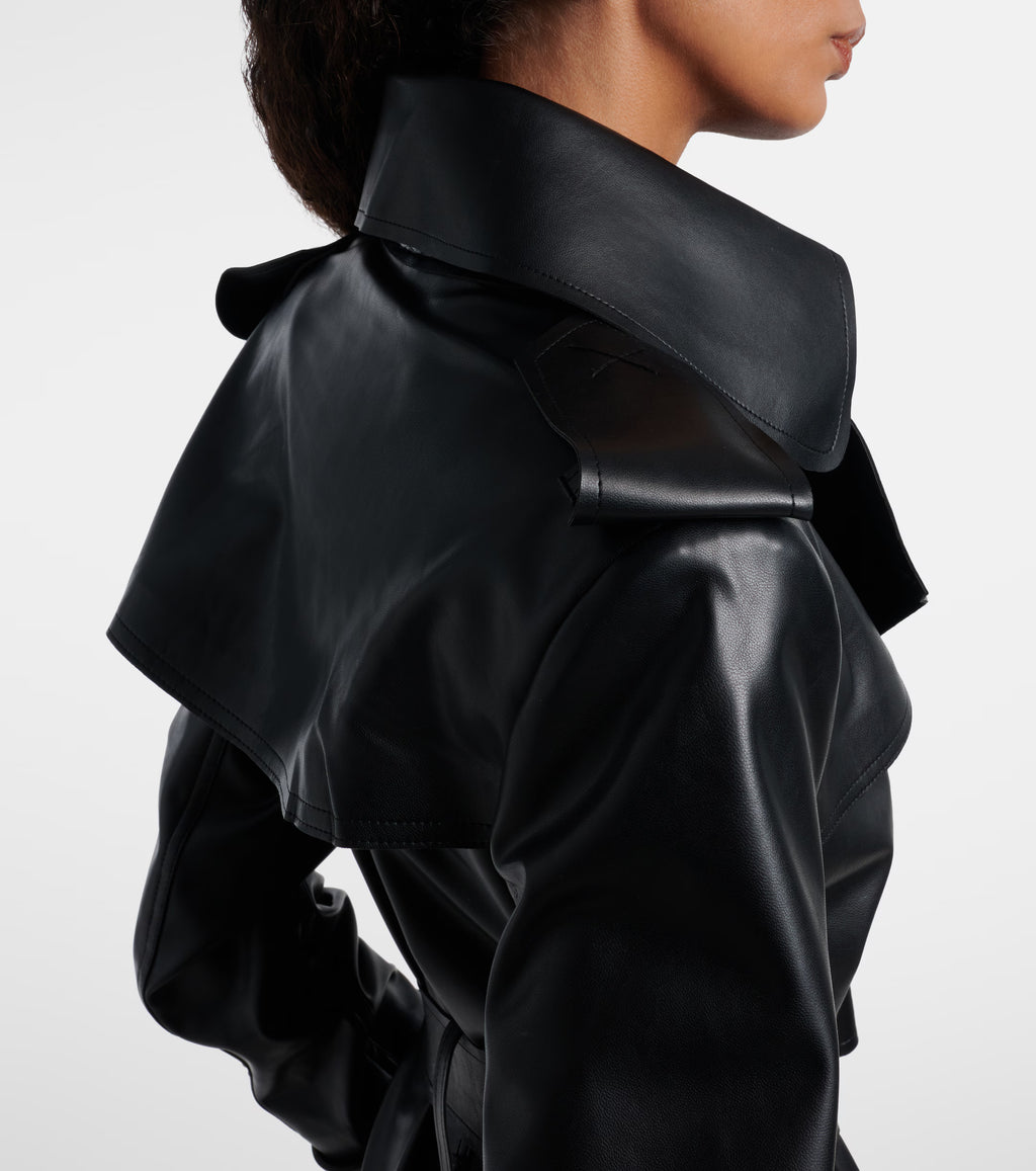 Sienna Noir women's jet black genuine Nappa lambskin leather jumpsuit featuring a trench coat style notch collar, chest storm flap, shoulder epaulettes, self-tie leather waist belt, wide-leg trousers, and custom made-to-measure fitting across the UK, USA, and Australia.side