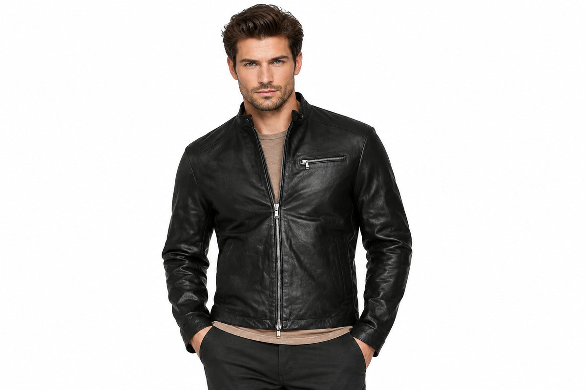 Front view of a man wearing the black Sleek & Minimalist Cafe Racers Jacket featuring a stand collar and full-zip front closure.