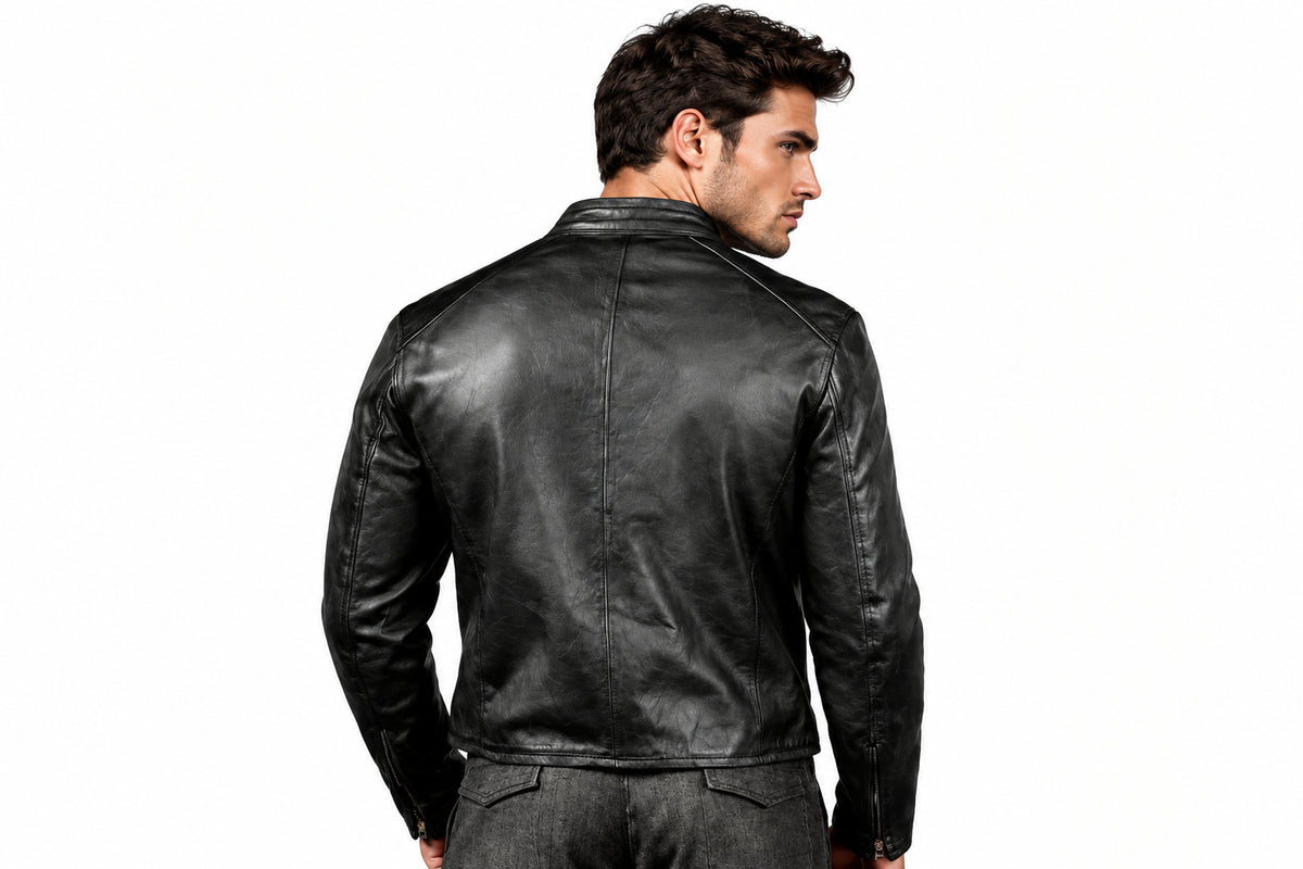 Back view of a man wearing the Stealth Matte Black Biker Jacket featuring a snap-tab collar and full-zip front closure.