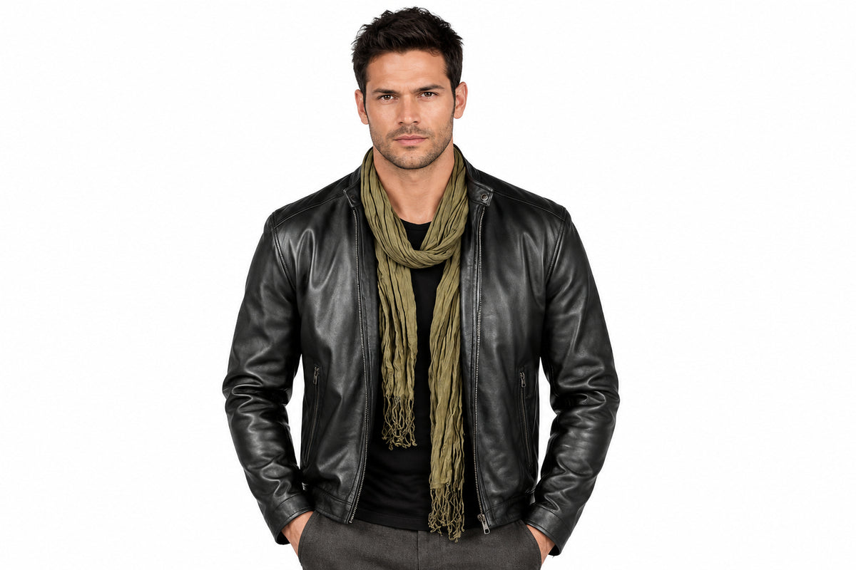Front view of a man wearing the Stealth Matte Black Biker Jacket featuring a snap-tab collar and full-zip front closure.