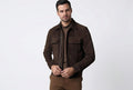 Front view of a man wearing the dark brown Storm Forge Signature Luxe Suede Leather Jacket featuring dual chest pockets and a shirt collar.