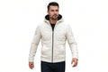 Front view of a man wearing the sand white Storm Grain Sand Mens Lambskin Leather Modern Cut Jacket featuring an integrated hood and diamond quilted stitching.