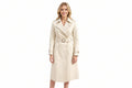 Storm Vixen women's creamy ivory-beige genuine lambskin leather long trench coat featuring wide notch lapels, double-breasted button closure, military shoulder epaulettes, matching buckle-fastened waist belt, adjustable cuff straps, knee-length fit, and custom made-to-measure fitting across the UK, USA, and Australia.