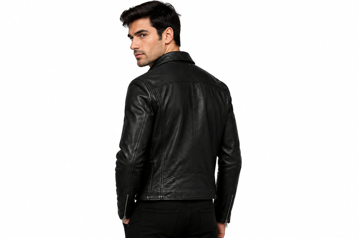 Back view of a man wearing the black Sunburst Patina Leather Jacket featuring a notched lapel collar and offset front zipper.   