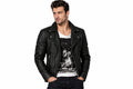 Front view of a man wearing the black The Axis Modern Leather Biker Jacket featuring a notched lapel collar and offset front zipper.