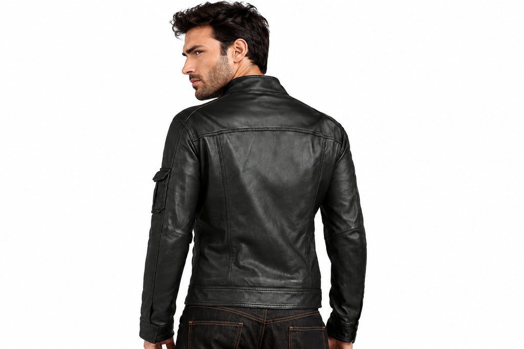 Back view of a man wearing the black The Backcountry Distressed Biker Jacket featuring a snap-tab collar and multi-pocket utility layout.