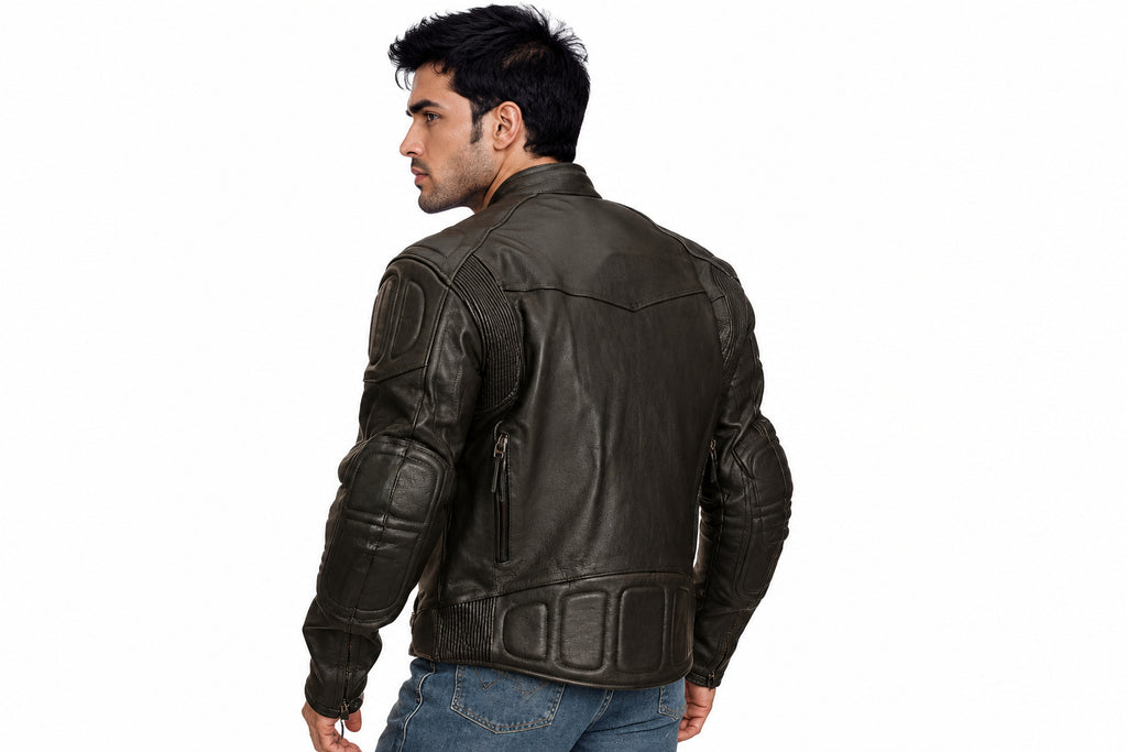 Back view of a man wearing the black The Bespoke Atelier Biker Jacket featuring a snap-tab collar and multi-zip layout.