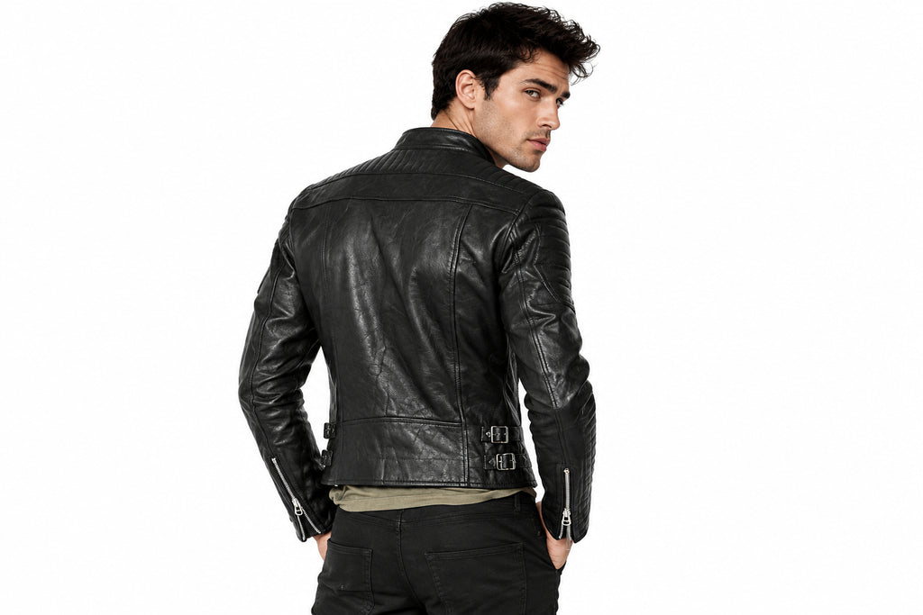 Back view of a man wearing the black The Gridline Minimal Biker jacket featuring a snap-tab collar and asymmetrical double-breasted zip layout.