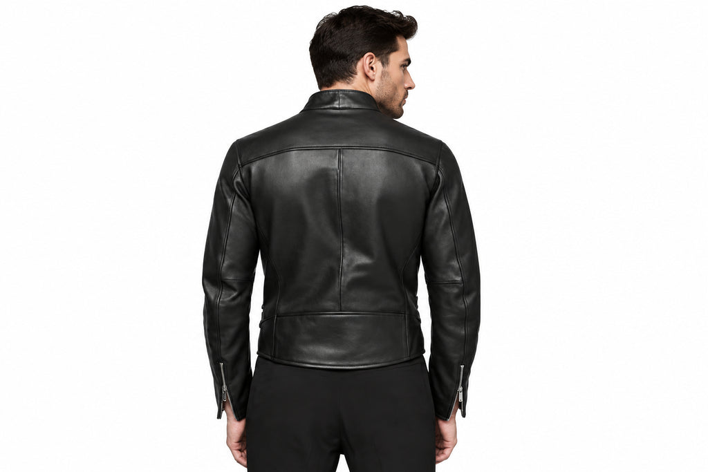Back view of a man wearing the black The Ironclad Double Rider Jacket featuring an asymmetric stand collar and side buckle details