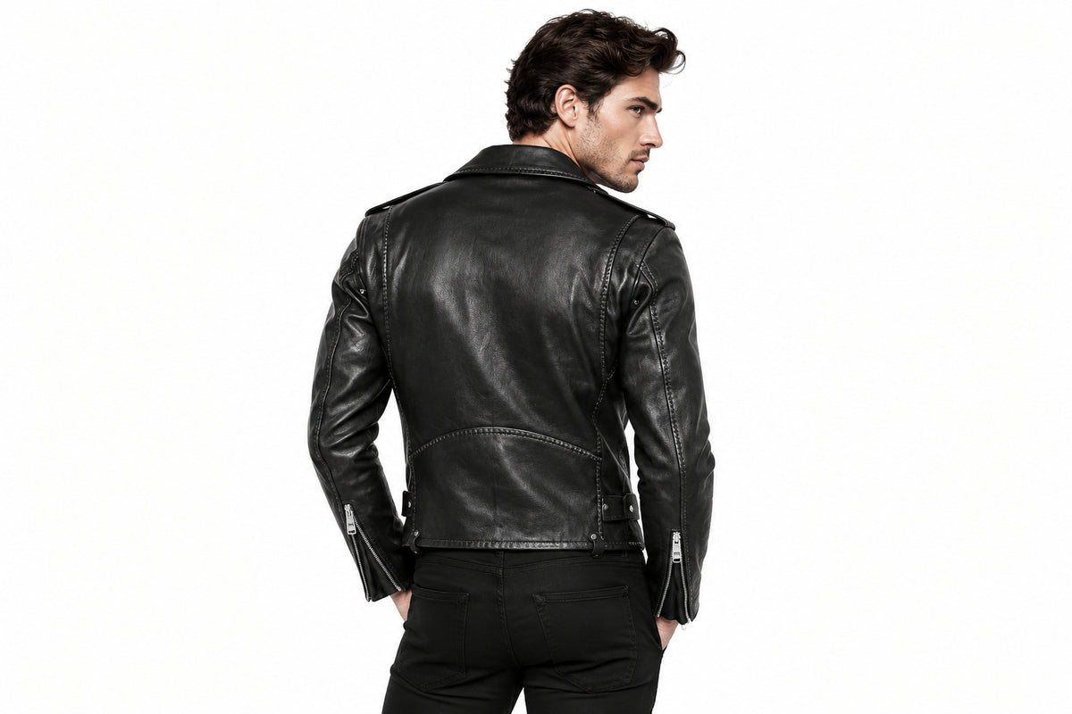 Back view of a man wearing the black The Maverick Asymmetrical Biker Jacket featuring studded lapels and an adjustable waist belt.