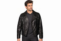 Front view of a man wearing the black The Nightfall Tactical Biker Jacket featuring notched lapels and an asymmetrical zipper.
