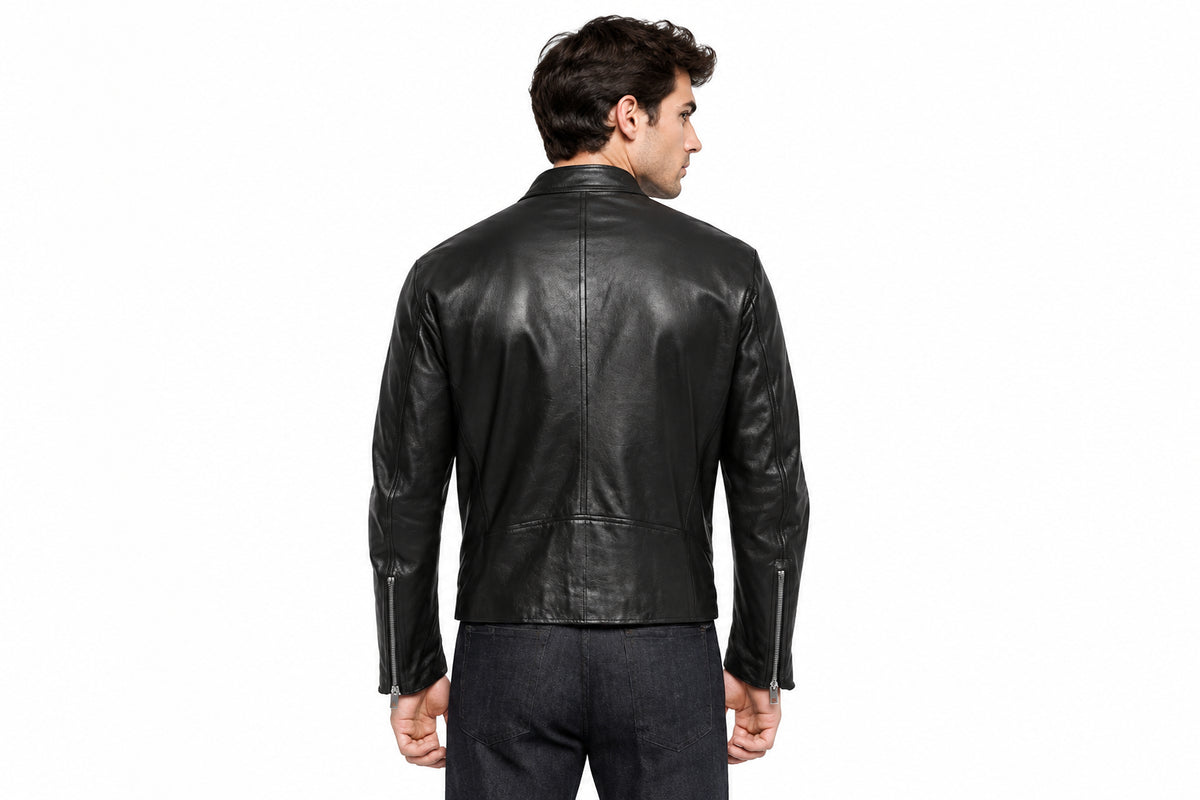 Back view of a man wearing the black The Rebel Moto Icon Leather Jacket featuring a stand collar and vertical zippered chest pockets.